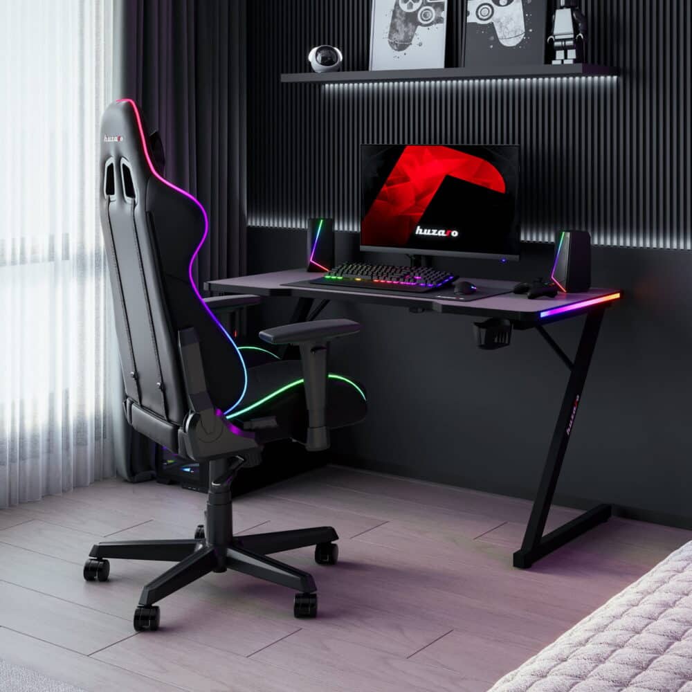 Gejmerski sto Huzaro Hero 2.5 RGB LED u sobi sa gejmerskom stolicom